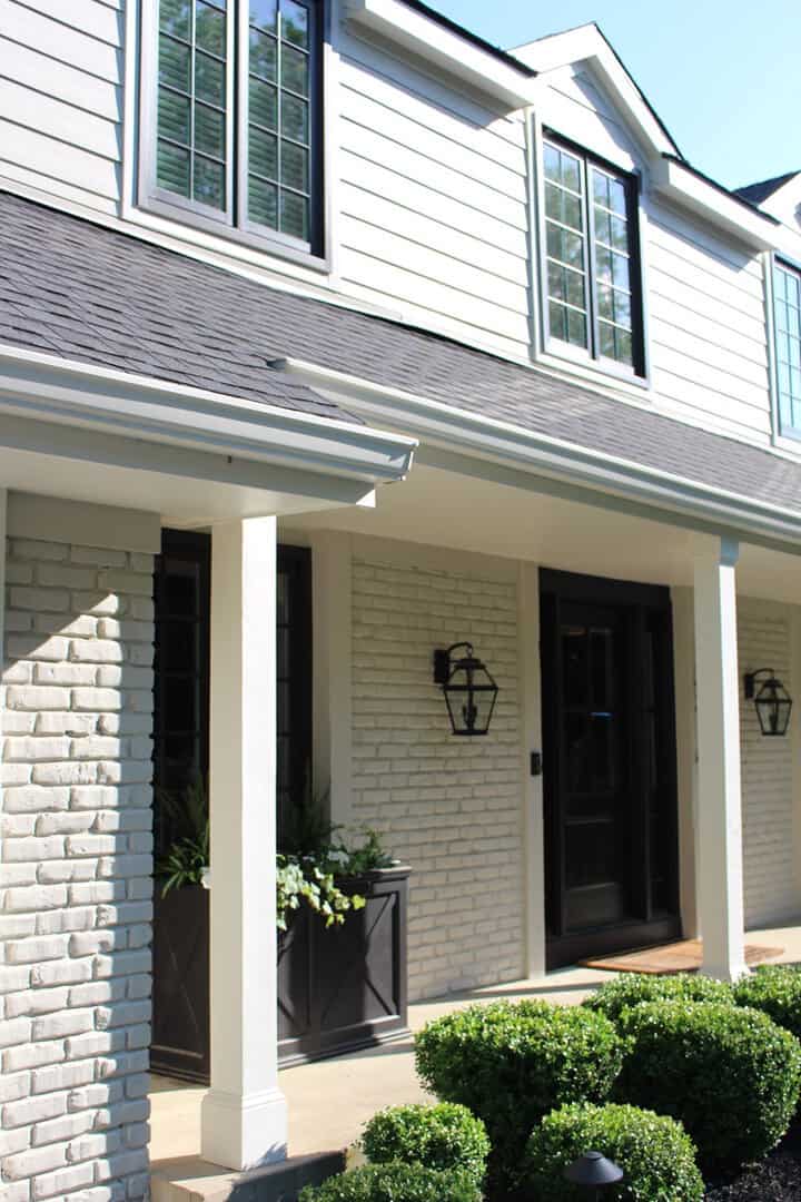Beautiful Kansas City home exterior with white brick and black accents.