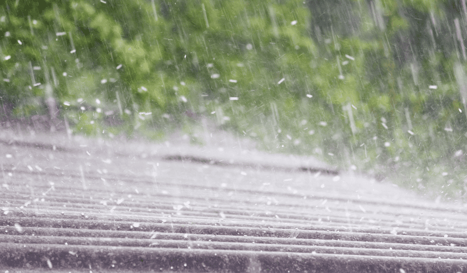 Rainstorm hitting a car windshield during a storm in Kansas City.