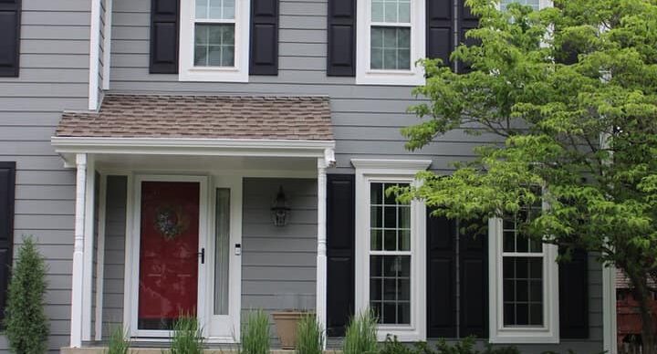 Kansas City exterior home renovation with fresh paint and landscaping.